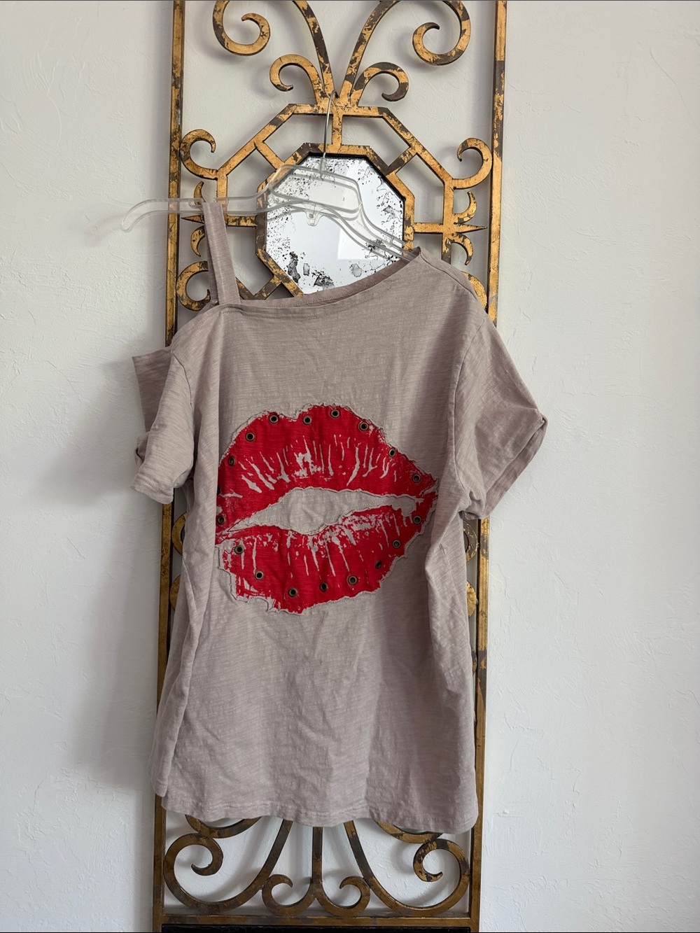 Taupe Off-Shoulder Tee with Red Lip graphic and grommets around the red lips!👄